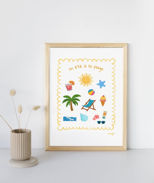 Affiche Un été à la plage encadrée sur une console blanche